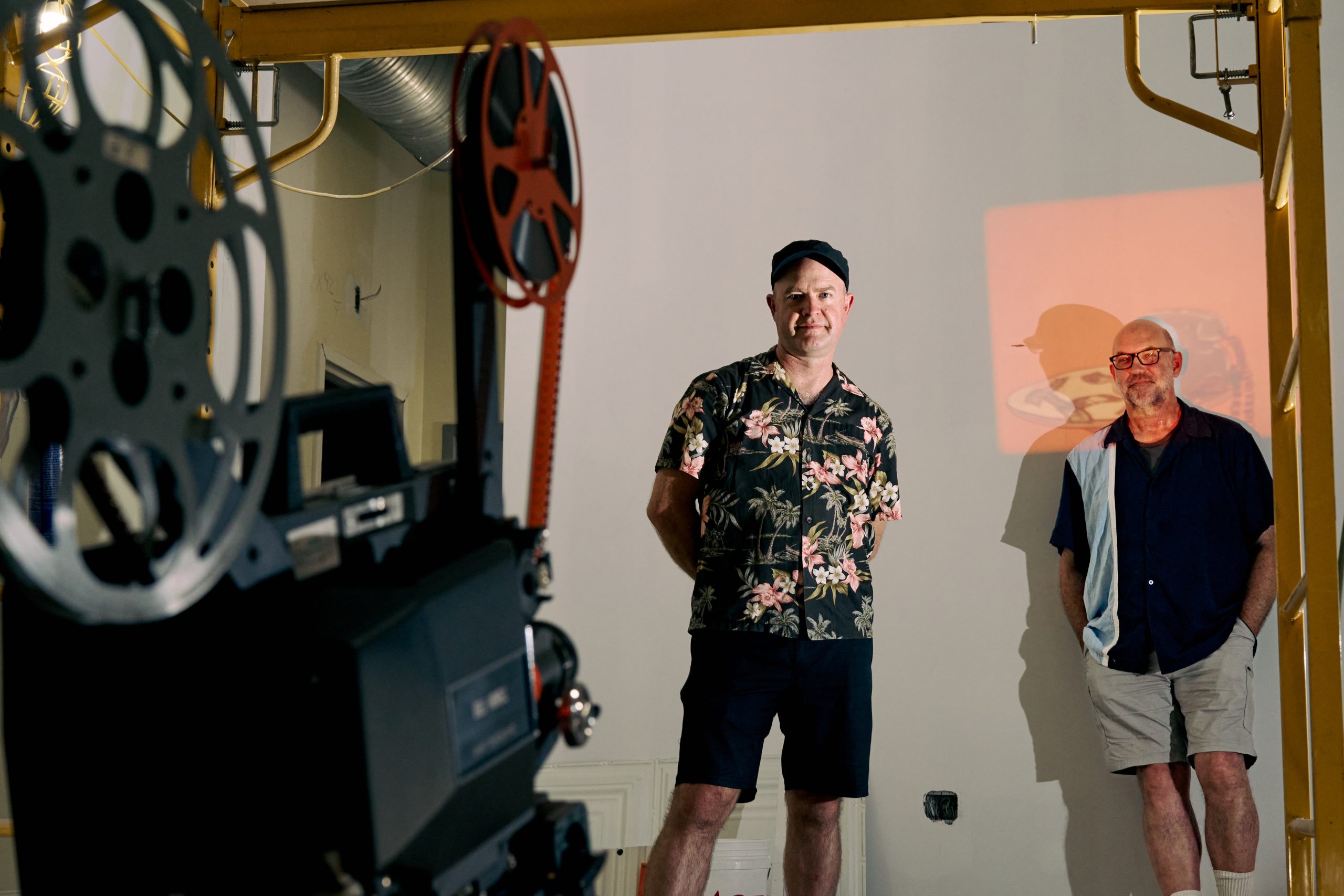 (From left) Alex Maness and Jim Haverkamp pose for a portrait in the space that will be Skin and Bones Theater. Photo by Matt Ramey. 
